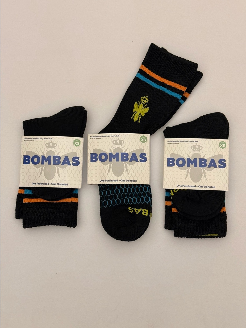 Bombas Men's Black Crew Socks with Blue and Orange Stripes - 3 Pack